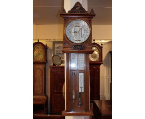 A Victorian oak cased Admiral Robert Fitzroy Torricelli barometer with storm glass and thermometer, the case with carved flor