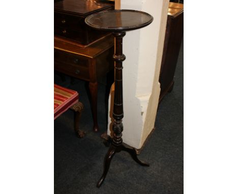 A mahogany jardiniere stand with circular top, on baluster turned stem and outswept tripod legs, 110cm high, (LC)