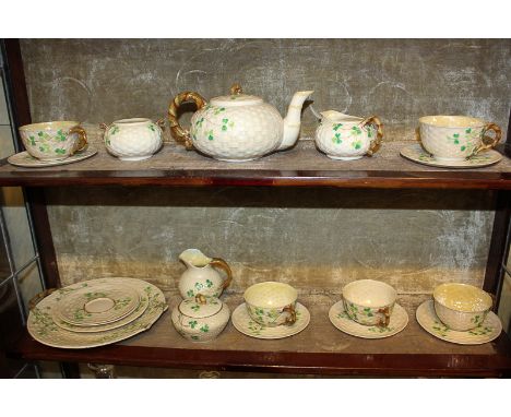 A Belleek porcelain part tea service comprising teapot, sugar bowl and jug, five teacups, seven saucers (one a/f), side plate