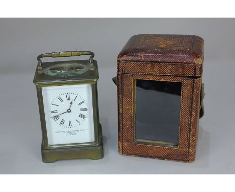 A brass and bevelled glass cased carriage clock, the white enamel dial marked Goldsmiths & Silversmiths Company, 112 Regent S
