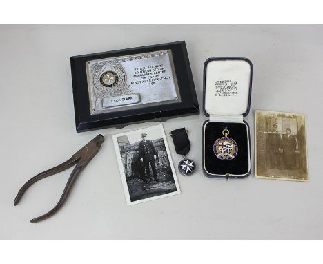 A Southern Railway 9ct gold 50 years' service medal, presented to A Clark 1888-1938, cased, a small black and white photograp