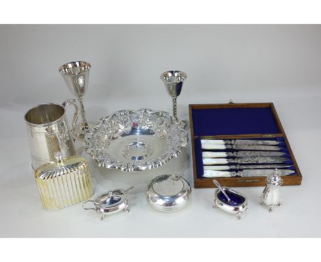 A collection of silver plated items to include a tankard, two goblets, a hip flask, cruet set, embossed bowl, and a cased set