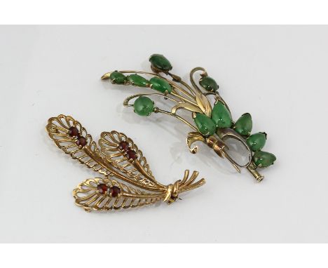 A jade floral spray brooch in 14ct gold and a garnet set floral spray brooch