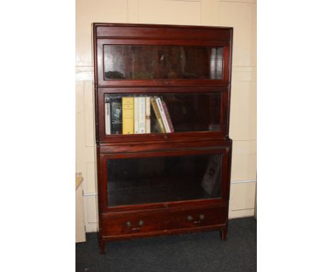 A mahogany Globe Wernicke style bookcase with three glazed shelves above drawer, on block feet, 86.5cm