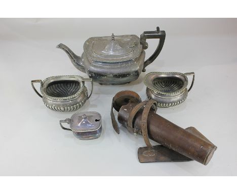 An Elkington silver plated teapot, rectangular shape with gadrooned border, a cream jug, sugar bowl and cruet in similar desi