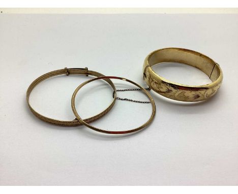 A Dainty 9ct Gold Bangle, of plain design (3.1grams); together with an Excalibur rolled gold hinged bangle and a '9ct Rolled 