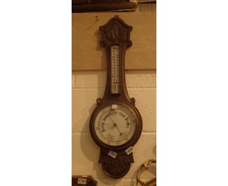 Oak barometer with temperature gauge, banjo style with cracked glass