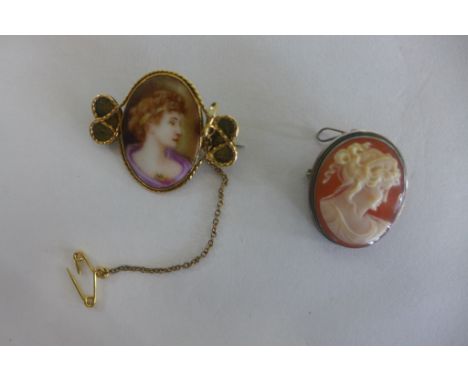 A gilt metal brooch with a portrait of a lady on porcelain - 3x4cm, a cameo brooch in white metal, some scratches to porcelai