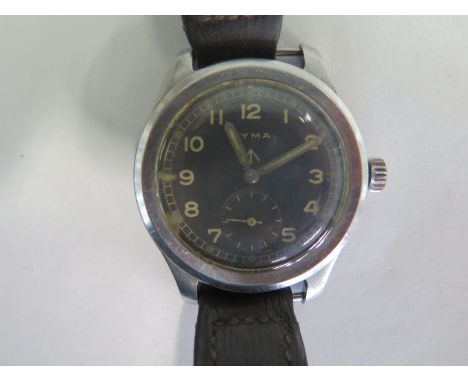 A Cyma Military Dirty Dozen manual wind wristwatch with black dial and crows foot, reverse side crows foot above WWW P23137 2