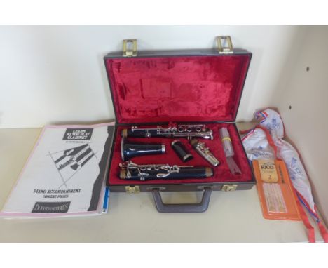 A Buffet Crampon Evette ebonite clarinet, serial number 190491, with fitted hard case, some reeds and sheet music, in good co