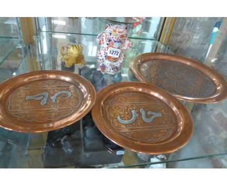 An Imari style frog, 13cm tall and a Japanese nodding toad, both good and three Islamic copper plates with white metal inlay,