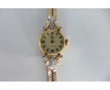 An Ebel 18ct yellow gold diamond encrusted manual wind ladies cocktail watch, not working but case in good condition, length 