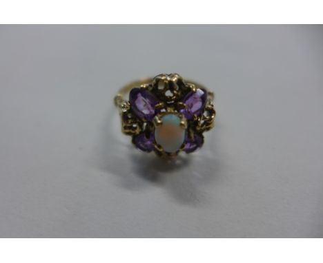 A 9ct gold opal and amethyst dress ring, size Q, 3.8 grams 