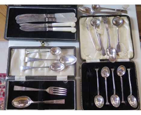 Eight pieces of silver flatware, and a cased set of six spoons, knife and fork and two silver bladed knives,total silver weig