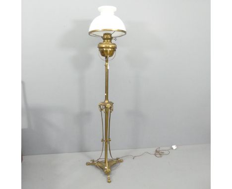 An early 20th century brass floor standing oil lamp, converted to electric. Height 160cm. 