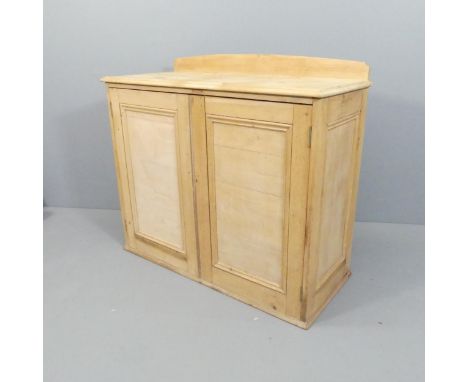 An antique pine two-door cabinet, with raised back and shelf fitted interior. 107x96x47cm. 