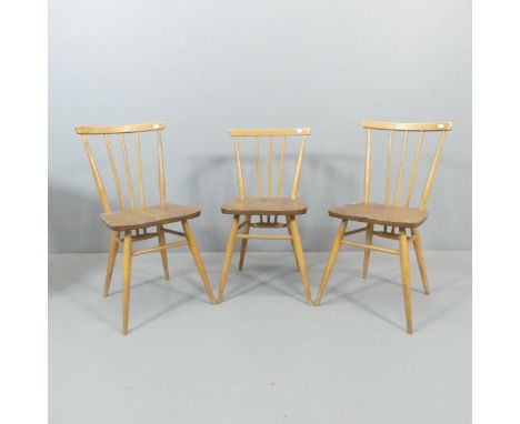 ERCOL - Three Windsor stickback dining chairs. Lacking maker's marks, but all having kitemarks to underside and dated 1960. A