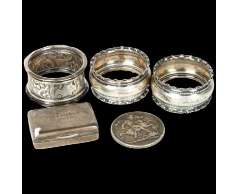 A Victorian 1889 silver crown, 3 various silver napkin rings, and a small silver box engraved The Skipper 1905 