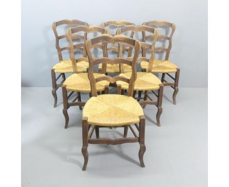 A set of six oak ladder-back dining chairs.One rear stretcher missing. 