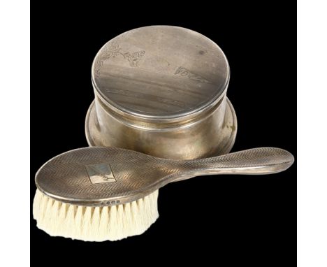 An engine turned silver-backed hand brush, Birks, an early 20th century sterling silver circular jewel box and cover, blue ve