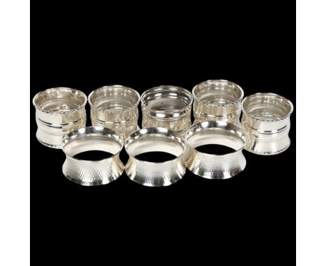 8 silver napkin rings, to include a set of 4, a set of 3, and 1 other, 5oz 