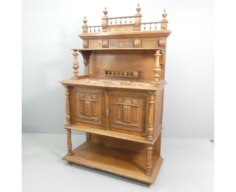 A French oak and marble topped buffet, with raised back, two cupboard doors, open shelf under, and turned and applied carved 