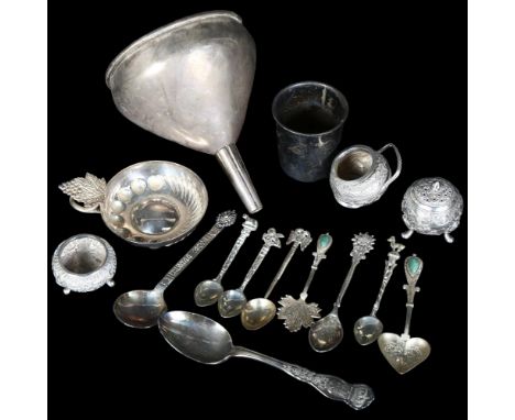 A group of silver and plated ware, to include a 3-piece Indian white metal cruet set, a large plated wine funnel, various tea