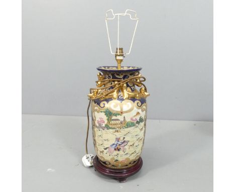 A modern Chinese baluster table lamp with cream pleated shade. Height to bayonet 50cm. 