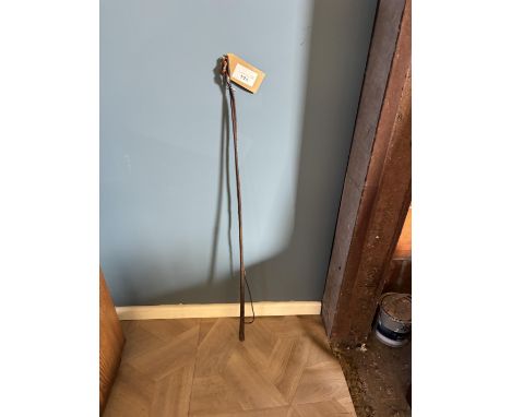 Steel lined dealer's whip with decorative butt end
