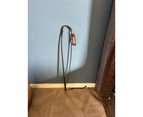 Dealer's whip, with figurative man falling off horse and a French coin in the butt end.