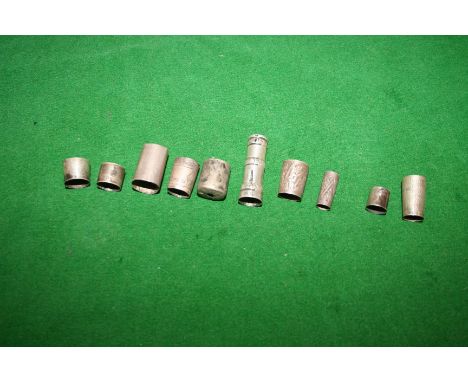 Ten assorted whip collars and caps, all marked silver