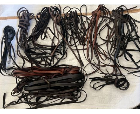 Nine English leather reins including tandem reins; set of Zilco traces; set of English black leather traces.