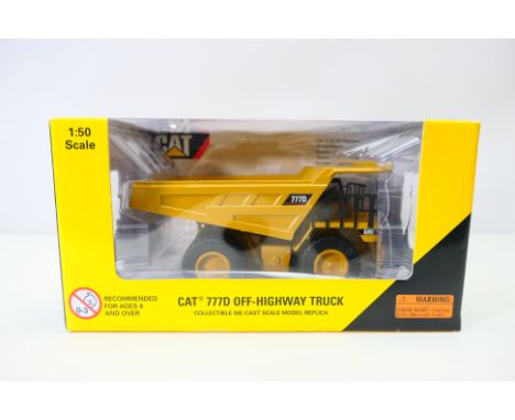 Norscot - A boxed CAT 777D Off Highway Dump Truck in 1/50 scale # 55104. The model appears Mint in a Good box with some stora