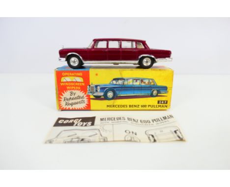 Corgi Toys - A boxed Corgi #247 Mercedes Benz 600 Pullman. The model in Metallic maroon with cream interior, spun hubs and fe