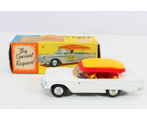 Corgi Toys - A boxed Corgi Toys #430 Ford 'Bermuda' Taxi. The model with white body, with yellow and red canopy, and yellow i
