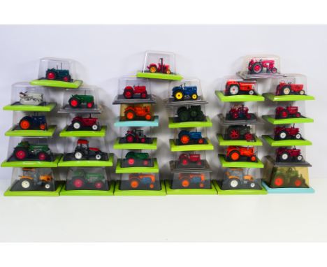 Hachette - A herd of 31 boxed diecast model tractors from Hachette. Lot includes BabioleSuper Babi 203 1954; Vendeuvre Super 