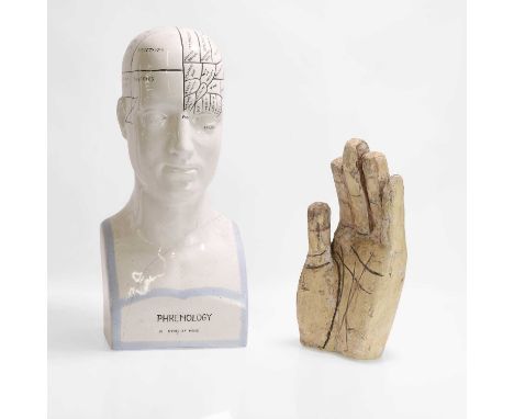 A medical pottery phrenology bust, 20th century, a phrenology pottery head/bust,47cm high, anda Chinese wooden hand,possibly 