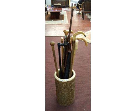 Stick stand together with collection of walking sticks 