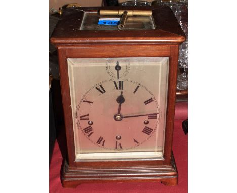 An Edward VII mahogany mantle clock, the three train movement with platform lever escapement and striking and chiming the qua