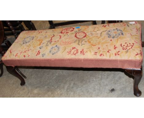 A long stool with tapestry top on cabriole legs. 45" wide