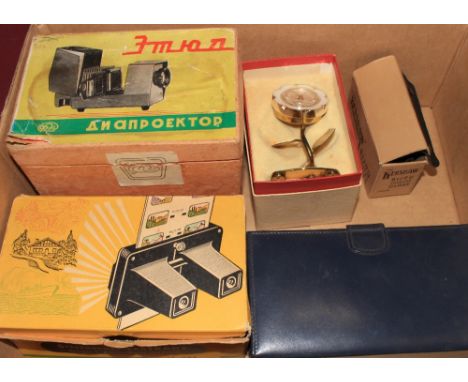 A 1950's stereo viewer, slide projector, opera glasses etc.