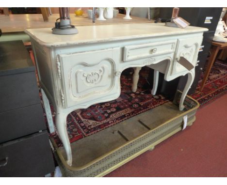 A French Louis style dressing table, distressed cream painted 120cm wide 