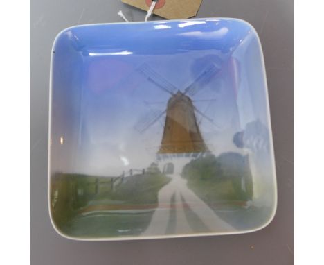 A Royal Copenhagen ceramic square wall plaque decorated with a windmill. stamped to back with makers initial 'K P'. 12x12cm