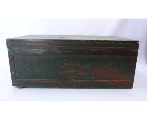 A green painted shipping trunk with hand painted crest H 56 x W 134 x D73cm 