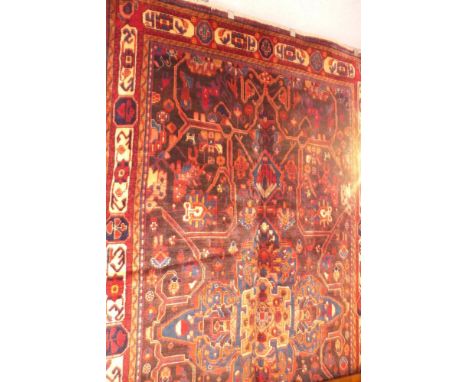 A fine North West Persian Nahawand carpet 295 x 155cm central eagle Kazak motifs with repeating Animal motifs within stylised