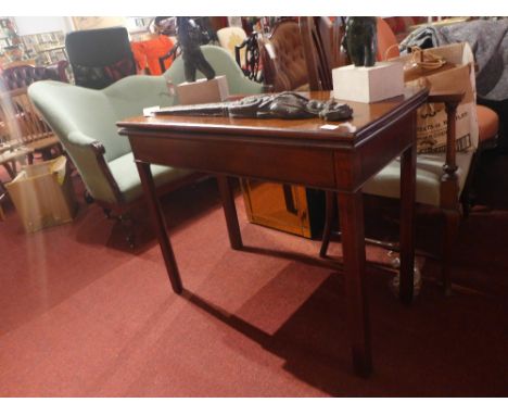 A Georgian mahogany rectangular tea table, with frieze drawer, raised on square section supports 