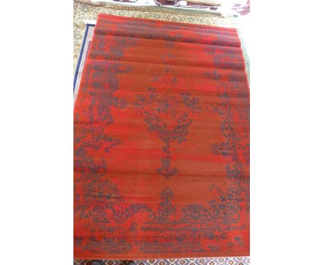 A Keshan style carpet, having a red field 230 x 160cm