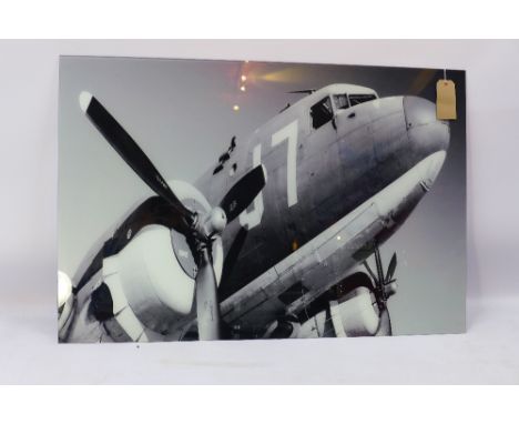 A contemporary print of a areoplane on glass. 120x80cm