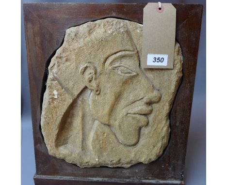 A stone plaque with carved portrait set in a mahogany stand, 42 x 35cm 