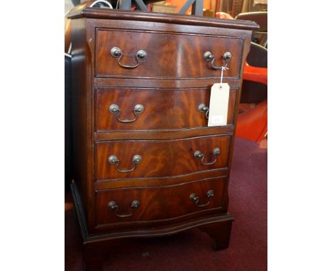 A mahogany serpentine fronted chest of four drawers and raised on carved bracket feet, H 73 x W 48 x D 40cm 